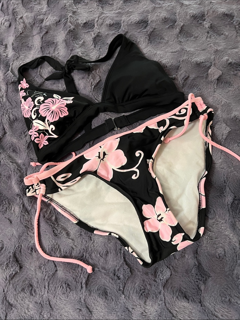 Arizona Jean Company Black Halter Bikini Top with Pink Floral Print bottoms.